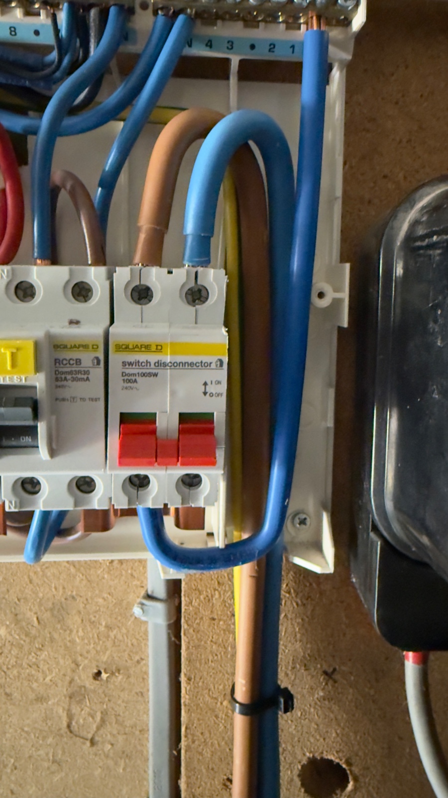 Incorrectly connected consumer unit tails found by electrician in Princetown Dartmoor